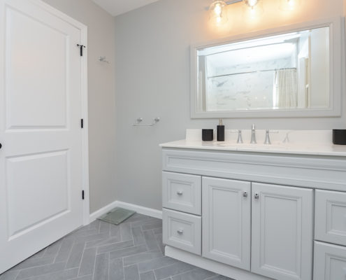 mullica hill master bath herringbone floor and vanity