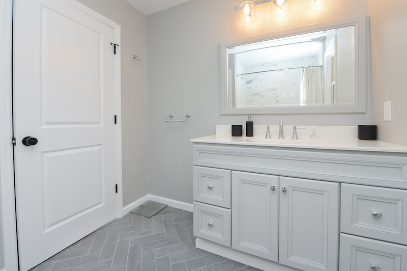 mullica hill master bath herringbone floor and vanity