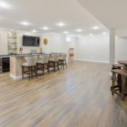 finished basement bar with recessed lighting