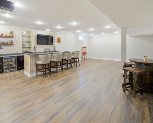 finished basement bar with recessed lighting