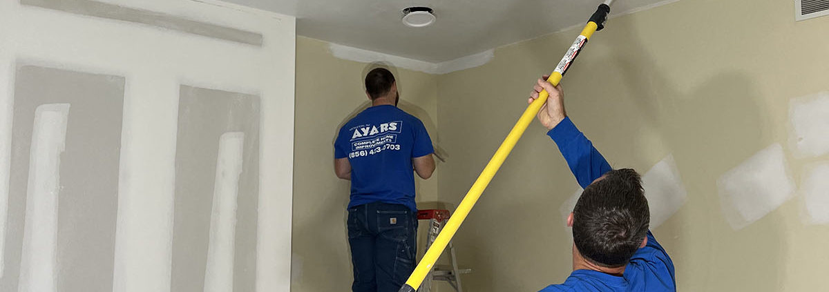 ayars interior craftsmen at work painting a room