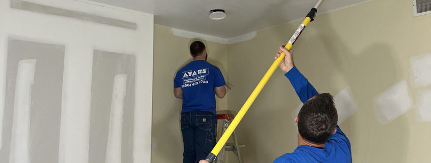 ayars interior craftsmen at work painting a room