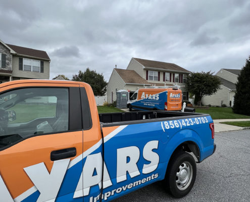 ayars company van and truck parked in front of south jersey home