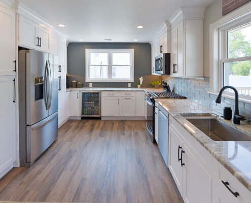 Kitchen remodel with natural lighting and white cabinets