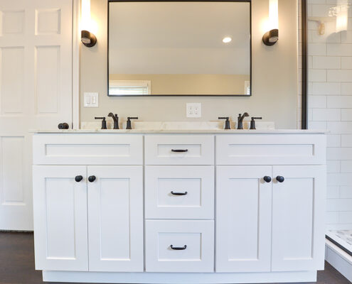 Modern master bathroom remodel, hanging mirror, white counters