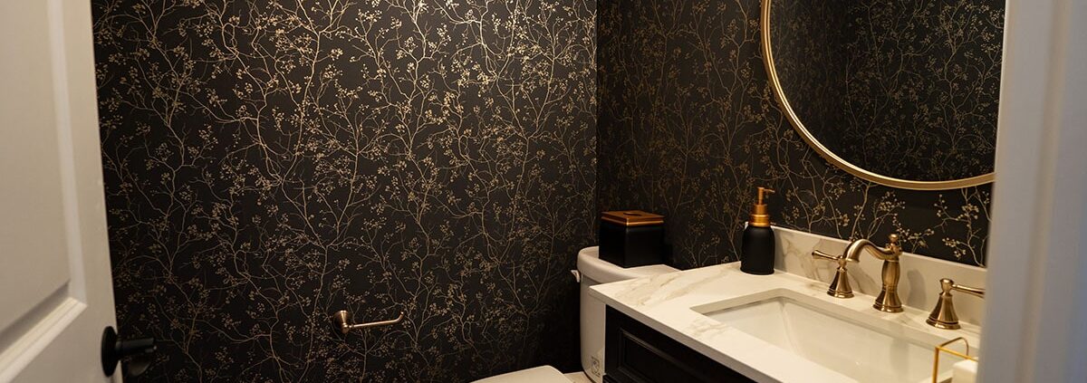 gold and green wallpapered basement half bath in sewell nj