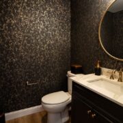 gold and green wallpapered basement half bath in sewell nj