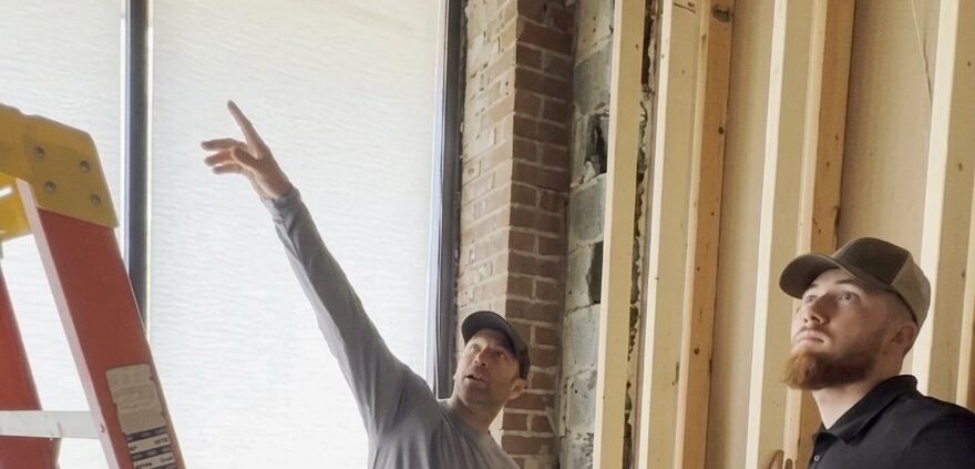 Ayars team reviewing framing during a remodel walkthrough