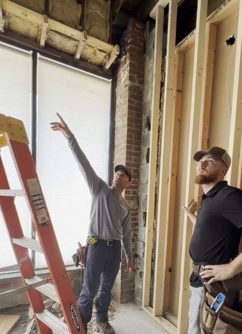 Ayars team reviewing framing during a remodel walkthrough
